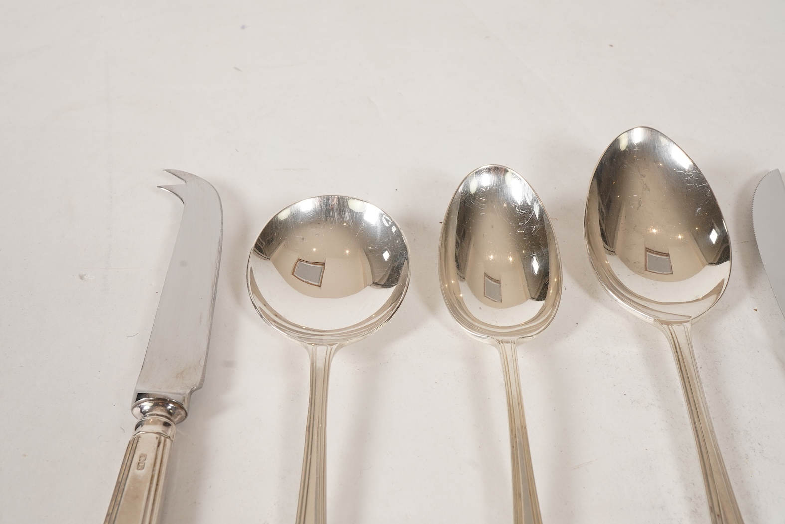 An Elizabeth II matched canteen of silver Grecian pattern cutlery for eight